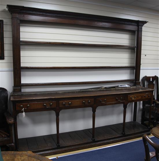 A large 18th century oak Welsh dresser, 8ft 7.5in.